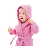Toddler in a pink hooded kids bathrobe