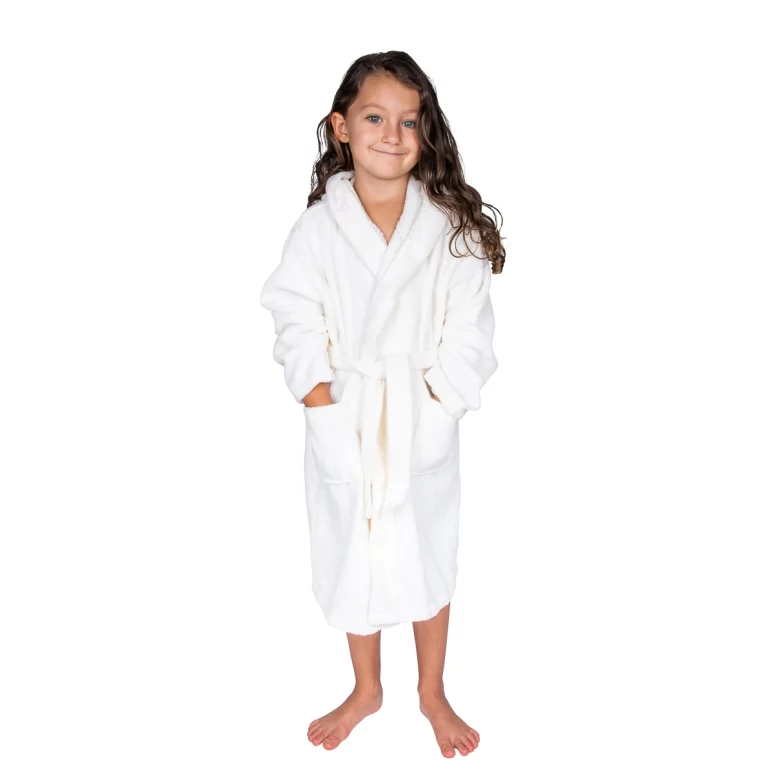 Girl wearing a white organic cotton kids bathrobe