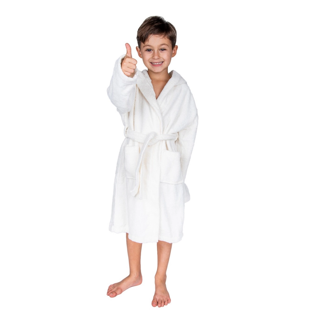Smiling boy giving a thumbs up in a white hooded kids bathrobe