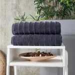 Charcoal Elegance towel set on a white shelf