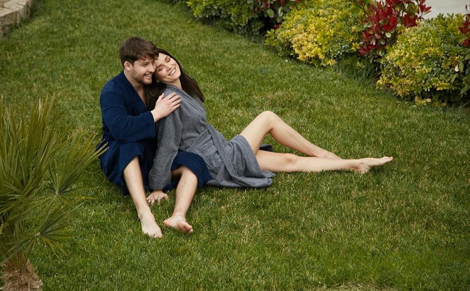 Couple relaxing outdoors on grass, man wearing gray Organic Cotton Soft Terry Robe (Hotel Collection) - Bagno Milano