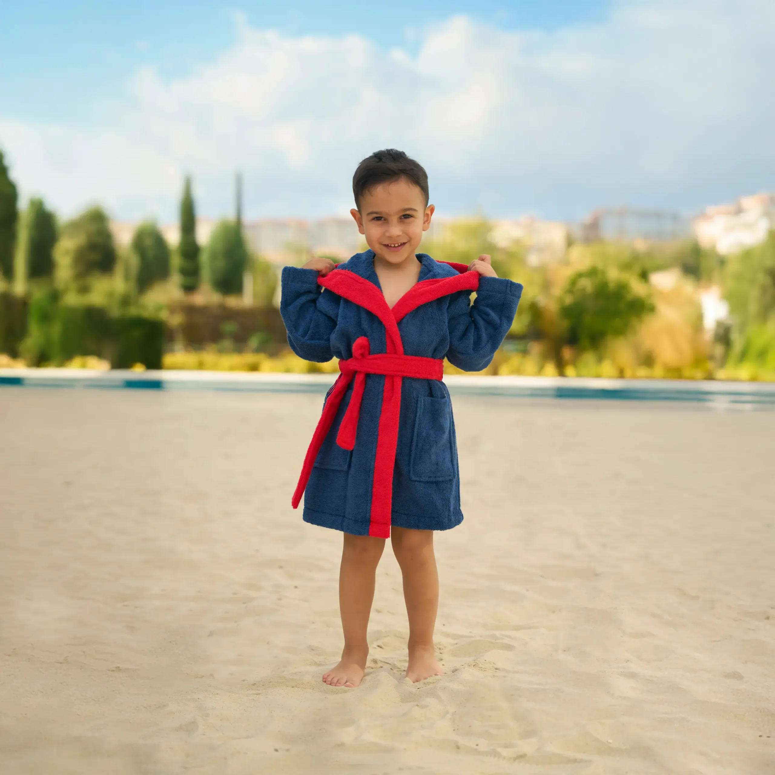 Organic cotton kids hooded bathrobe in navy racer car character design – Bagno Milano