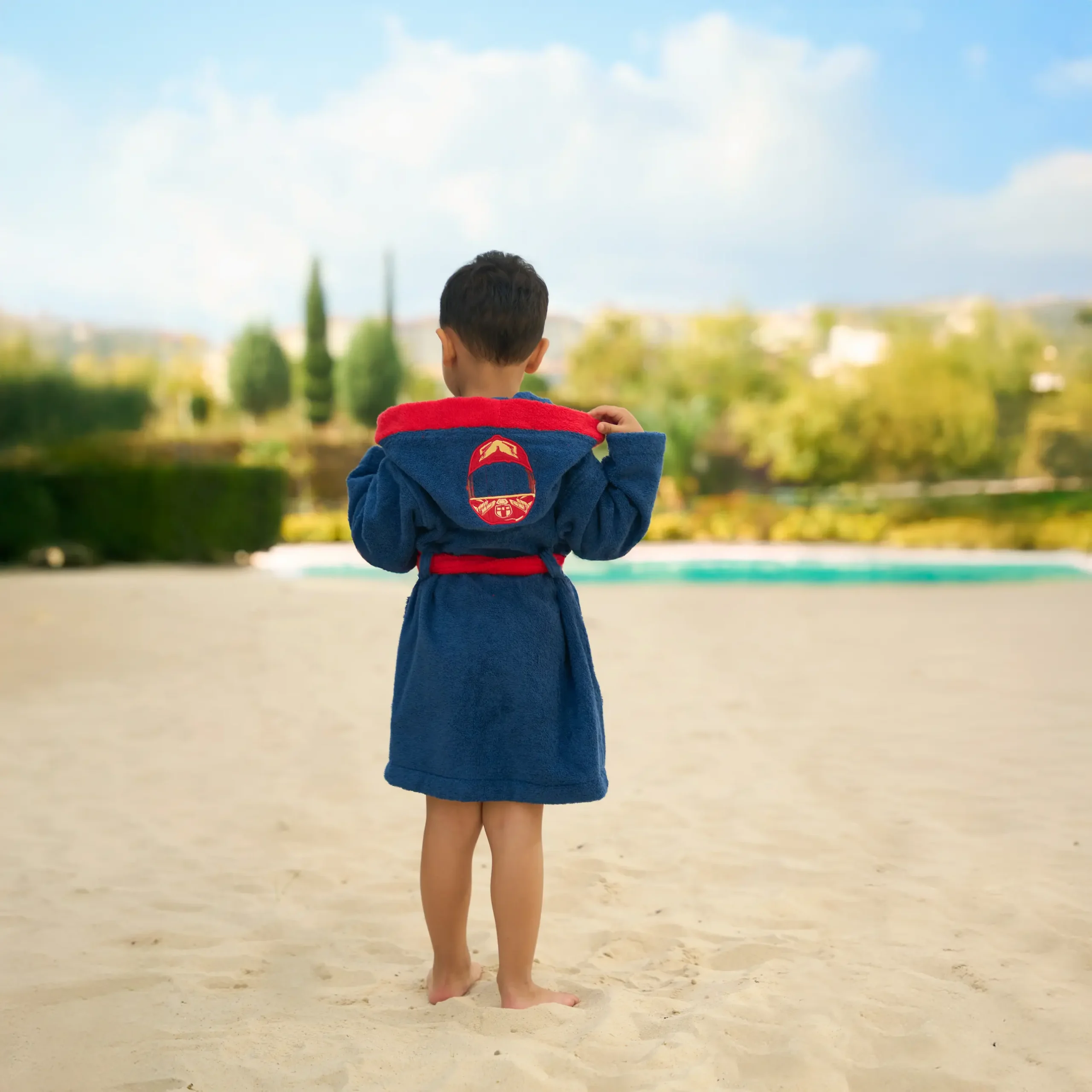 Organic cotton kids hooded bathrobe in navy racer car character design – Bagno Milano