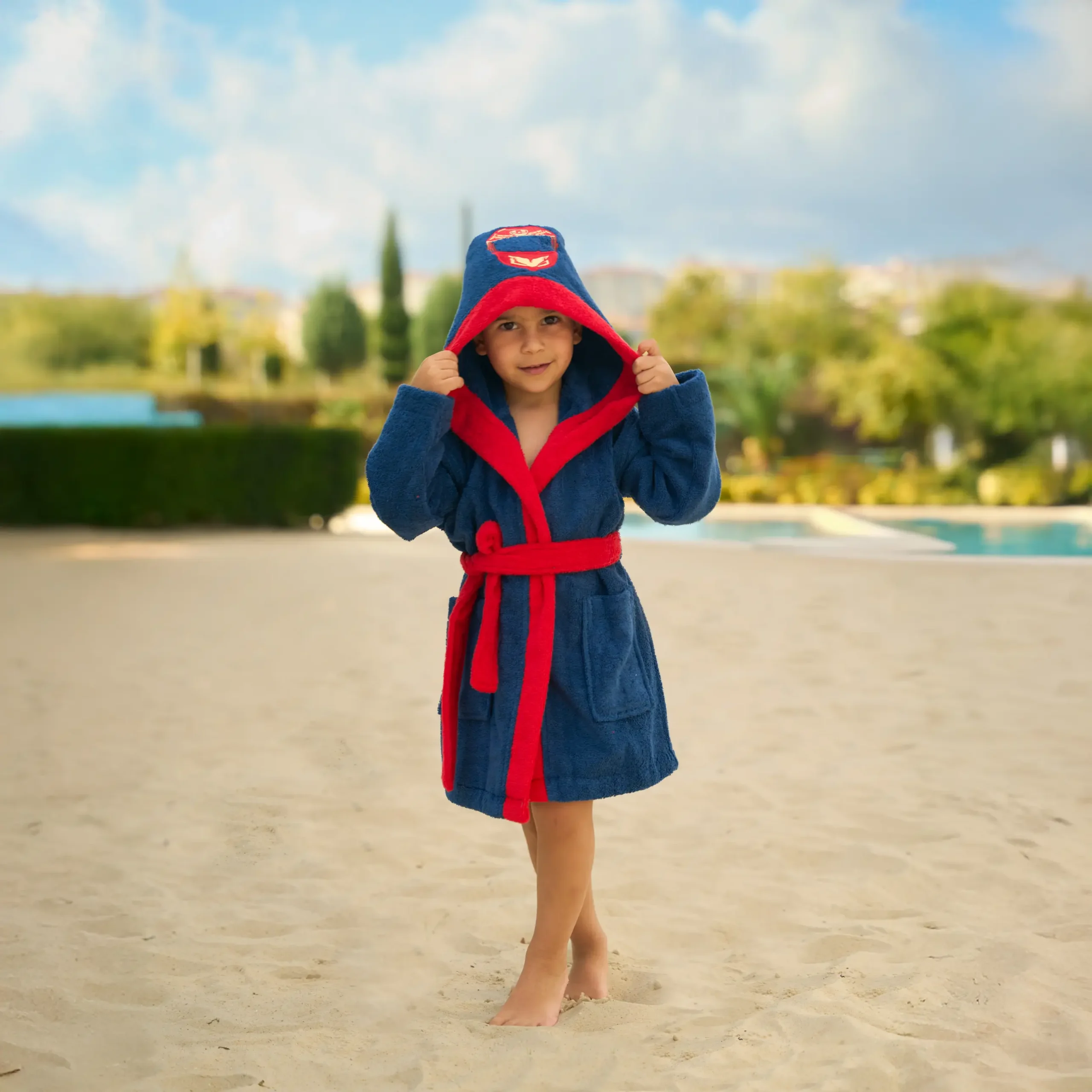 Organic cotton kids hooded bathrobe in navy racer car character design – Bagno Milano