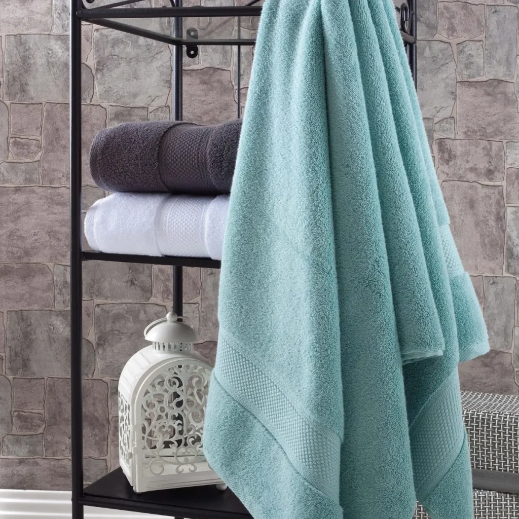 Aqua green Hotel Collection Turkish cotton towel on a bathroom rack