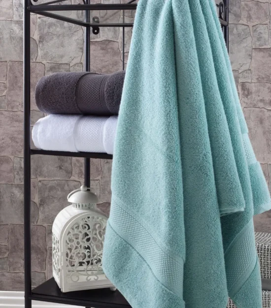 Aqua green Hotel Collection Turkish cotton towel on a bathroom rack