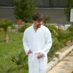 Man wearing a white organic Turkish cotton kimono robe