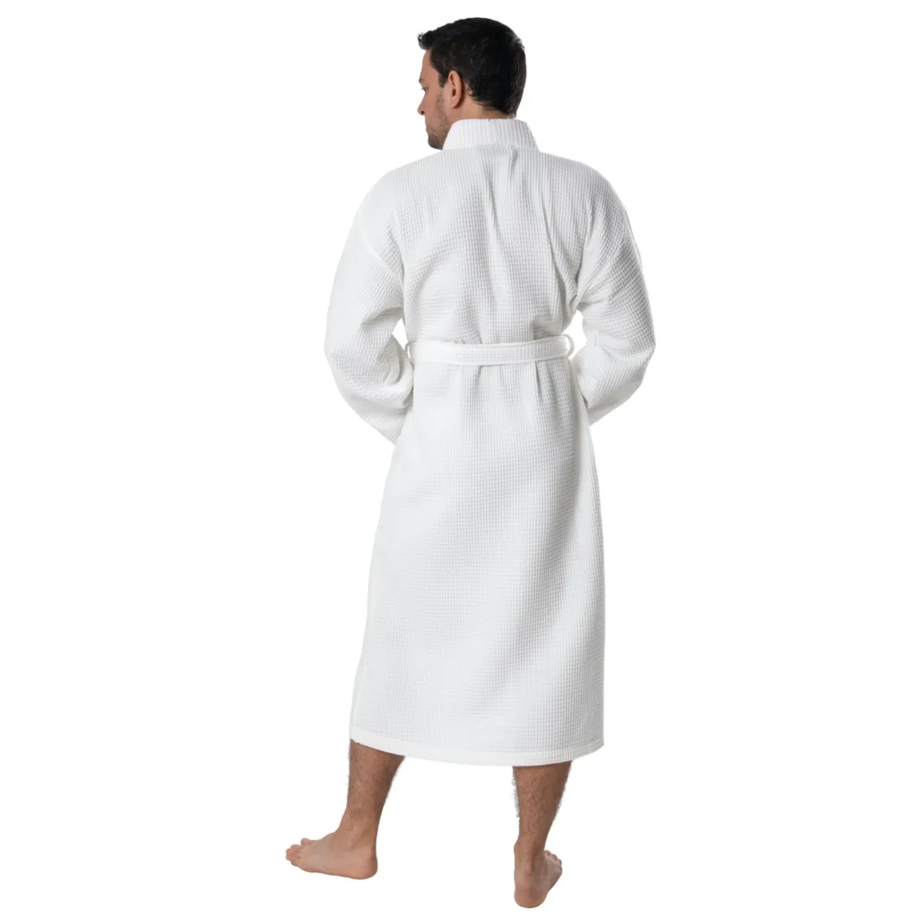 Man wearing a white waffle pique kimono robe, back view