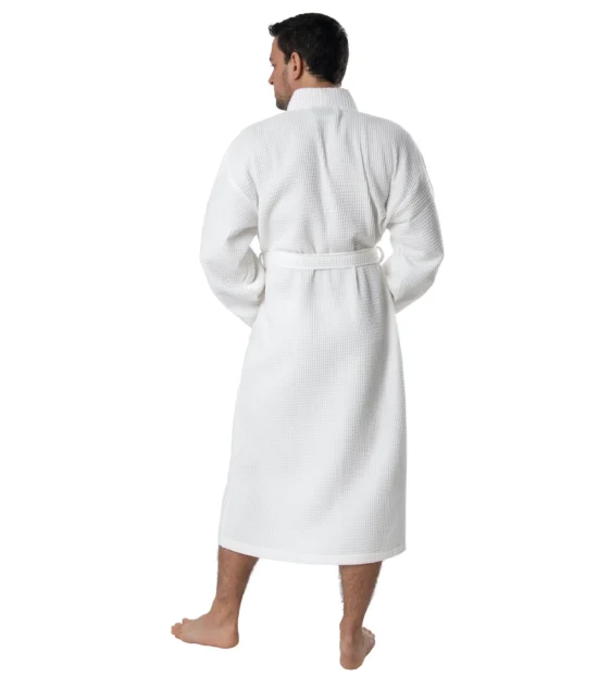 Man wearing a white waffle pique kimono robe, back view