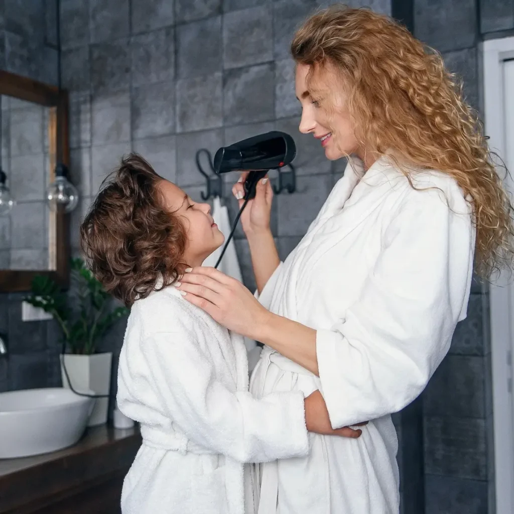Mother and child wearing white plush fleece robes