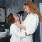 Mother and child wearing white plush fleece robes