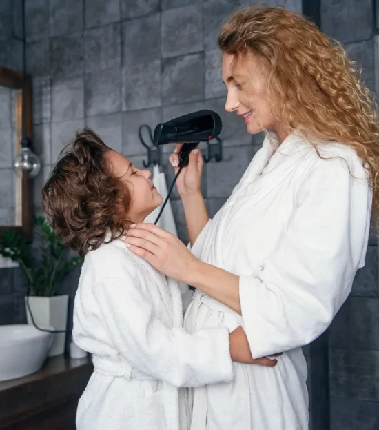 Mother and child wearing white plush fleece robes