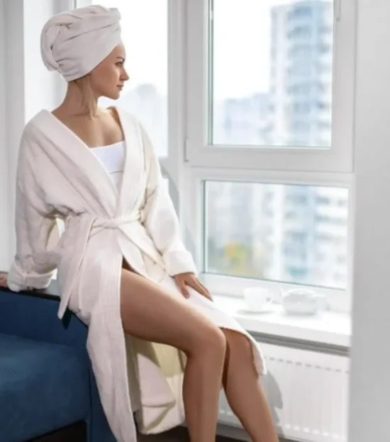 Woman in a white organic Turkish cotton kimono robe