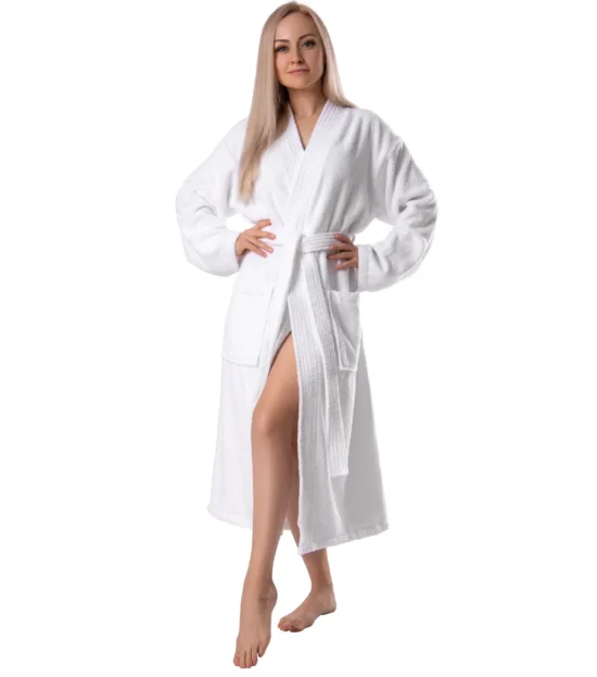 Woman wearing a white soft terry cotton robe with a kimono collar and tie belt, front view